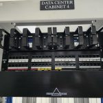 Photograph of a Siemon 48-port copper patch panel with cable management bars in Data Center Cabinet 4 at the MarQi Cloud Zone1 facility in Alpharetta, Georgia.